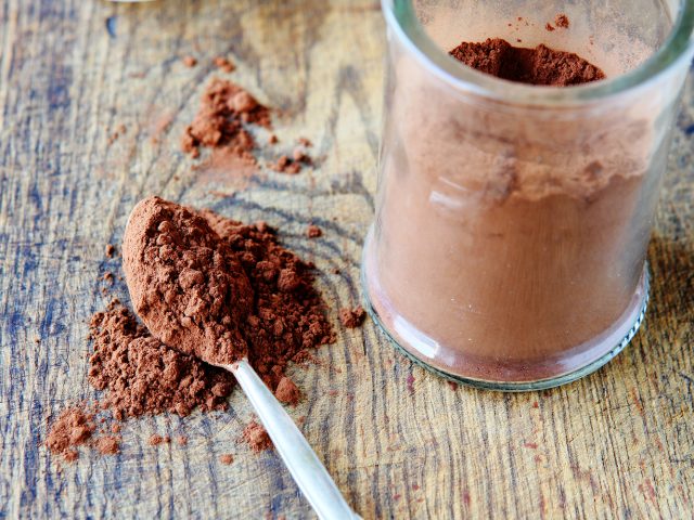 cocoa powder in a glass jar, food closeup