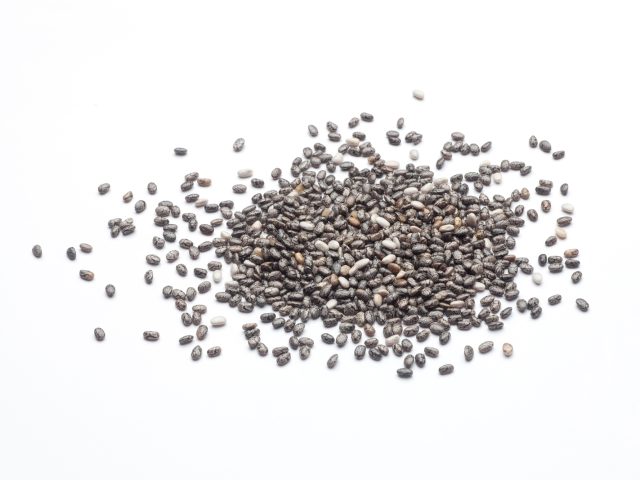 Heap of chia seeds isolated on white background